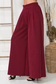 For a sophisticated and elevated look, these wide-leg pants offer an impeccable combination of luxury and comfort. The slight stretch ensures a perfect fit while the front leg pleats, pockets, and elastic waistband at the back add a stylish touch. Wide leg Slight stretch. Front pleats Pockets 28"Inseam Elastic waist back. Content: 98% cotton/2% elastane Care Instructions: Machine wash Season: Fall/Winter Solid Wide-leg Bottoms With Pleated Waist, Wide Leg Bottoms With Pleated Waist, Wide Leg Pants With Pleated Waist, Business Casual Wide-leg Pleated Pants, Loosely Fitted Trousers With Pleated Waist, Trousers With Pleated Waist And Loosely Fitted Hips, Spring Wide Leg Pants With Pleated Waist, Chic Wide-leg Pants With Pleated Waist, Pleated Wide-leg Workwear Culottes