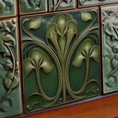 decorative tiles on the wall in an art nouveau style