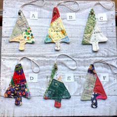 an assortment of handmade christmas trees are displayed on a piece of paper with letters