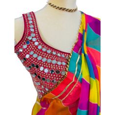 Contemporary multi colored saree that fits any occasion. Ideal as festive wear, wedding wear, casual or cocktail dine in.  this 5.5 meters of elegance as beautiful detailing with exclusive Gota Patti work from Rajasthan to enhance the look. The leightweight and soft material makes it very easy to drape and carry. Comes with very contemporary unstiched blouse material which can be mix and matched with other outfits. Festive Multicolor Chanderi Pre-draped Saree, Bollywood Style Multicolor Pre-draped Saree For Navratri, Bollywood Multicolor Pre-draped Saree For Navratri, Festive Multicolor Pre-draped Saree With Unstitched Blouse, Multicolor Chanderi Pre-draped Saree With Zari Work, Bollywood Style Pre-draped Saree With Cutdana For Summer, Summer Blouse Piece With Mirror Work In Traditional Drape, Multicolor Pre-draped Saree With Zari Work, Summer Festive Georgette Choli