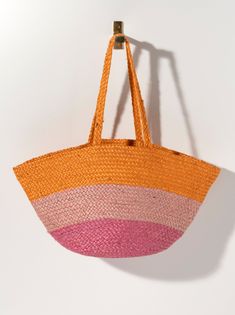 Add a pop of color to your summer accessories with Shiraleah’s Liza Tote. This tote features a multi-color stripe pattern upon a woven braided texture, making it the perfect warm weather bag. Measuring L 23" x W 6" x H 12.5", and made from jute, the Liza Tote is equipped with double handles, perfect for carrying all your essentials. Pair with other items from the Shiraleah collection to complete your look! Color: Sunset L 23" X W 6" X H 12.5"; Hnd 11" Material: Jute Double Shoulder Straps Made I Striped Summer Beach Bag, Striped Summer Beach Bag For Beach Season, Summer Striped Beach Bag For Beach Season, Casual Multicolor Straw Beach Bag, Spring Striped Beach Bags, Spring Beach Striped Bags, Casual Striped Straw Bag For Beach, Striped Bags For Spring Beach Outings, Striped Woven Rectangular Beach Bag