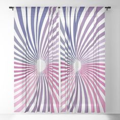 a purple and white curtain with an abstract design in the center, on top of a wall