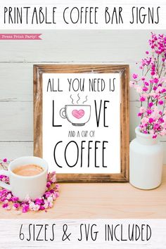 the printable coffee bar sign is displayed next to a cup of coffee and pink flowers