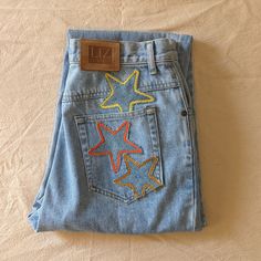 Reworked vintage light wash mom jeans. These jeans are reworked with handmade star patches in a mainly yellow and orange color pallate. All pockets are fully functional. Patchwork Star, Light Wash Mom Jeans, Star Patches, Reworked Denim, Patchwork Clothes, Diy Jeans, Vintage Mom Jeans, Reworked Vintage, Jean Pockets