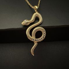 "Gold Snake Necklace, 925k Sterling Silver Tiny Snake Pendant, Minimal Serpent Charm, Hecate's Snake Pendant, Modern Jewelry, Gift for Her Little Snake has a lot to say  🐍 🐍  Snakes represent dual expression of good and evil. Our little snake shows her good side. \"By night one way, by day another  Thus shall be the norm  Till you receive true love's kiss  then, take love's true form.\" Princess Fiona - 3𝟎% 𝐝𝐢𝐬𝐜𝐨𝐮𝐧𝐭 𝐚𝐩𝐩𝐥𝐢𝐞𝐬 𝐰𝐡𝐞𝐧 𝐲𝐨𝐮 𝐩𝐮𝐫𝐜𝐡𝐚𝐬𝐞  2  𝐢𝐭𝐞𝐦𝐬 𝐭𝐨𝐠𝐞𝐭𝐡𝐞𝐫 - Item Details, ✔️ Made of certified 925k sterling silver ✔️ 14k Gold Plated ✔️ Height of the pendant is 2.8 cm (1.1 inches) ✔️ 45 cm silver chain is included in price ✔️ Zircon stones were used on the pendant ✔️ Free, Express, and Insured Shipping ✔️ Unique minimalist design You can chec Cheap Snake Shape Necklace For Gift, Luxury Snake-shaped Necklace For Formal Occasions, Snake-shaped Engraved Jewelry Gift, Engraved Snake-shaped Jewelry Gift, Snake Chain Jewelry As Gift, Gift Jewelry With Curb And Snake Chain, Snake Shape Clavicle Chain Jewelry As A Gift, Snake-shaped Tarnish Resistant Jewelry Gift, Tarnish Resistant Snake-shaped Jewelry Gift