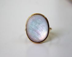 Mother of Pearl Gold Ring - Mother of Pearl- Gift for Her- Promise Ring -June Birthstone   Stone Size  - 15x18 mm appr        9K,10K,14k18K,22K Solid fine Gold Band Width - 1. 4 MM Gold Colour Options -  Yellow Gold, White Gold, Rose Gold  Ready to Ship 1-2 weeks Customization is available, I also can make it with 9k,10k,14k,18k,22k solid gold (white or rose), and diamond accent stone, just feel free to contact me.  *    PACKAGING: The Ring will be delivered in its own jewelry box. Gift wrapping Pearl Gold Ring, Maximalist Jewelry, Box Gift Wrapping, Jewelry Box Gift, Pearl Gifts, Glass Beads Jewelry, Gem Ring, June Birthstone, Gold Colour