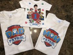 three children's t - shirts with cartoon characters on them, one for mom and the other for dad