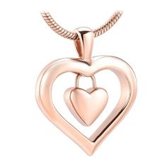 You can carry the remains of that person you love very close to your heart and wherever you are, show your love for that loved one. Do it with this beautiful Heart Charm Cremation Pendant that is made of high quality Stainless Steel that contains a small heart inside a larger heart. In order to fill this cremation pendant with cremains, it is necessary to open a hidden screw that is at the base of the heart. Accepts a small amount of ashes. We recommend putting a dab of glue on the screw to ensu Rose Gold Heart-shaped Keepsake Jewelry, Heart Shaped Locket Necklace For Memorial, Keepsake Double Heart Necklace With Heart Charm, Keepsake Double Heart Jewelry With Heart Beads, Keepsake Double Heart Charm Necklace, Double Heart Keepsake Jewelry For Valentine's, Double Heart Necklace For Mother's Day Memorial, Valentine's Day Double Heart Keepsake Jewelry, Valentine's Day Keepsake Double Heart Jewelry