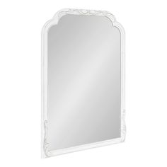 a large white mirror with an ornate frame