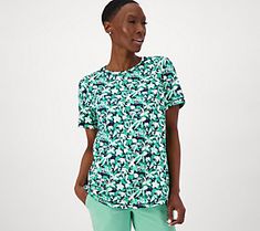 Add some personality to your warm-weather wardrobe with this short-sleeve top. The Perfect Jersey material keeps you cool and comfy, while the bold print makes a strong style statement. From Denim & Co.® Fashions. Casual Patterned Spring T-shirt, Green All Over Print T-shirt For Spring, Green All-over Print T-shirt For Spring, Green T-shirt With All Over Print For Spring, Patterned All Over Print T-shirt For Spring, Spring Patterned T-shirt With All Over Print, Casual Floral Print Short Sleeve Top For Summer, Casual Green Printed Tops, Casual All Over Print T-shirt For Spring