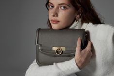 Introducing the Grace Flap Bag, a timeless embodiment of classic elegance. This exquisite bag elevates sophistication with its signature lock closure, inspired by a vintage door handle. Crafted with full-grain calfskin from USA, this versatile companion strikes a harmonious balance between modern minimalism and timeless charm. Elegant Workwear Bags With Turn-lock Closure, Elegant Shoulder Bag With Turn-lock Closure For Work, Elegant Shoulder Bag With Turn-lock For Work, Timeless Formal Bag With Lock, Timeless Formal Bags With Lock, Elegant Rectangular Bags With Lock, Elegant Formal Bag With Lock, Classic Evening Bag With Lock, Classic Top Handle Flap Bag With Palladium Hardware