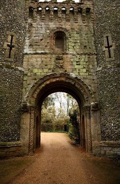 the entrance to an old stone castle