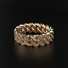 a gold and diamond bracelet on a black background