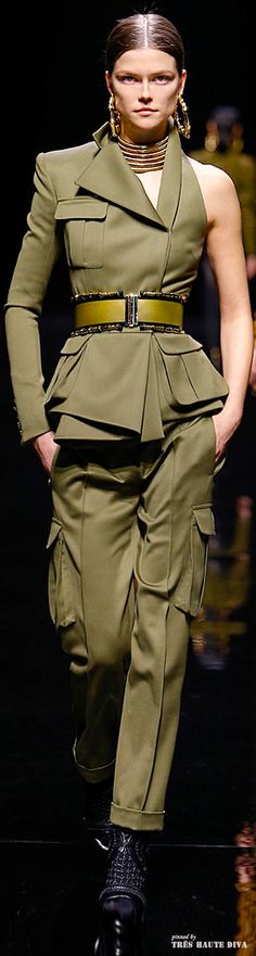 This design has clear military inspiration. The placement of the pockets is very similar to the placement on military garments. The color of this garment is military green. This garment varies from that of a historic military uniform because of the asymmetric design. Pinned by Bethany R. 2/29 Military Costumes, Mode Tips, Emily Didonato