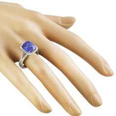 Stamped: 14K Total Ring Weight: 6.7 Grams Tanzanite Weight 6.00 Carat (10.50x9.00 Millimeters)Diamond Weight: 0.70 carat (F-G Color, VS2-SI1 Clarity )Face Measures: 13.15x11.50 Millimeter SKU: [601127] Cushion Cut Gemstones With Prong Setting For Formal Occasions, Formal Cushion Cut Gemstones With Accent Stones, Radiant Cut Tanzanite Ring For Formal Occasions, Cushion Cut Gemstones With Accent Stones For Formal Occasions, Formal Tanzanite Cushion Cut Ring, Elegant Tanzanite Gemstones Gia Certified, Gia Certified Tanzanite Cushion Cut Ring, Elegant Gia Certified Tanzanite Gemstones, Gia Certified Cushion Cut Tanzanite Ring