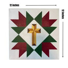 an image of a cross with red, green and yellow colors on white paper in the center