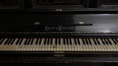 an old black piano with the words shut and berea written on it