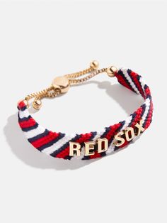 Proudly show off your team loyalty with the Boston Red Sox MLB Woven Friendship bracelet. This bracelet is crafted with colorful woven thread, which creates a vibrant backdrop for your favorite game day rallying cheer. Secured with an easy pull-tie closure, this spirited and nostalgic accessory will be loved by fellow fans all season long. Please note: due to their handmade nature, each bracelet will be slightly unique. This is an officially licensed MLB product. Adjustable Team Spirit Friendship Bracelets For Game Day, Casual Multicolor Bracelets For Game Day, Sporty Red Wristband For Sports Events, Red Sporty Wristband For Sports Events, Adjustable Red Bracelets For Sports Events, Sporty Red Adjustable Wristband, Adjustable Red Sporty Wristband, Casual Adjustable Wristband For Fan Merchandise, Personalized Red Casual Wristband