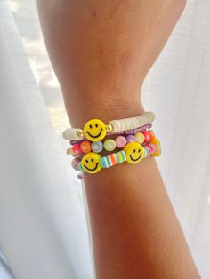 "🙂 Cheerful Color my smile bracelet 🙂 We get it, sometimes there's a lot going on and you just want to keep things simple... That's why this bracelet is perfect for you! With a wide range of colors, you can add a pop of color to any outfit with this simple smiley bracelet The \"Smile\" collection is meant to be for anyone who likes to have fun and be spontaneous! Materials: Disc beads, Smiley face 18K Gold Plated beads, Polymer clay Elastic cord Size: XS: 6.3in or 16cm S: 6.7in or 17 cm M: 7in Cheerful Adjustable Jewelry For Friendship, Trendy Everyday Bracelet With Smiley Face, Trendy Everyday Bracelets With Smiley Face, Cheerful Adjustable Beaded Bracelets, Trendy Everyday Smiley Face Bracelet, Playful Handmade Bracelets For Everyday, Playful Handmade Bracelets For Everyday Wear, Playful Everyday Handmade Bracelets, Playful Smiley Face Jewelry For Everyday