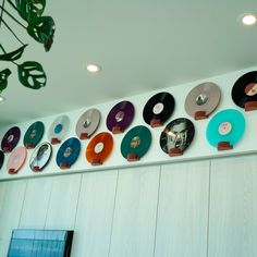 there are many records hanging on the wall