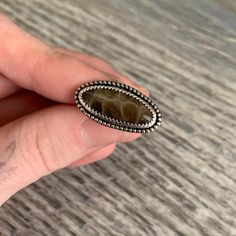 One of a kind Michigan Petoskey Stone Ring with beaded detail and plain slim band. The Petoskey Stone was self cut and polished. Size 7. Can not be altered, but custom orders are available where you can pick your stone. See my site for custom order details. High quality stone cabochons to choose from. Made here in Michigan by Ashley Goldsborough, Metalsmith and Lapidary Artist. Every ring comes in a beautiful Jewelry Ring Box that has an anti tarnish strip inside. You also will receive a polishing cloth and Jewelry Care Instructions to help ensure the longevity of your pieces.  Any issues with your order will be handled right away. -Ashley Goldsborough   Fresh Coast Jewelry Co.  freshcoastjewelryco@gmail.com  www.freshcoastjewelryco.com Petoskey Stone, Jewelry Care Instructions, Cabochons Stones, Jewelry Ring Box, Jewelry Ring, Ring Box, Stone Ring, Rings Statement, Stone Rings