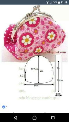 a pink purse with white flowers on it and measurements for the bottom half of the purse