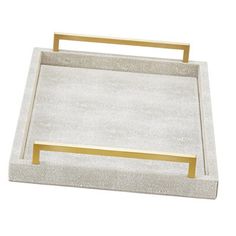 a white and gold serving tray with handles