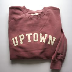 "The perfect vintage style sweatshirt that's already broken in with top stitched felt lettering. - This mauve unisex crewneck sweatshirt is so cozy and has that perfect, \"been washed 100 times\" look! The lettering is ivory wool felt top stitched to secure it to the front of the sweatshirt. Left sleeve has a cute embroidered pennant  ;) - Unisex sizing means that for WOMEN I recommend ordering a size smaller than your standard size or for an oversized look order your standard size. - Unisex siz Soft-washed Sweats For Everyday Fall Use, Fall Streetwear Sweatshirt With Letter Embroidery, Vintage Crew Neck Sweatshirt With Text Print, Vintage College Sweatshirt With Text Print, Vintage Fall Sweater With Letter Print, Vintage Letter Print Sweater For Fall, Comfy Sweats With Letter Print In Relaxed Fit, Comfy Sweats With Letter Print And Relaxed Fit, Fall Letter Embroidery Sweatshirt For Streetwear