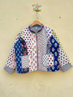 We are Presenting Collar Patchwork Jacket  Handmade Ships from a small business in India Materials: Cotton Gift wrapping available Indian Handmade Patchwork Jackets, Coats, Boho , Quilted, For Women`s Jacket Made In India Size - All Size WE INCREASE SIZE MEASURE AND UPDATED Small Size - Chest -38 inch Length- 20.5 inch APPROX Shoulder- 15.5 inch APPROX Sleeves -23 inch APPROX Medium Size - Chest-40 inch Length- 20.5 inch APPROX Shoulder- 15.5 inch APPROX Sleeves -23 inch APPROX Large Size - Ches Multicolor Patchwork Quilted Jacket For Spring, Multicolor Cotton Patchwork Outerwear, Cotton Gift, Patchwork Jacket, Cotton Gifts, White Leaf, Work Jackets, Print Jacket, Vintage Quilts