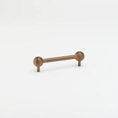 an image of a metal bar with two round knobs on the top and bottom