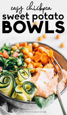 a bowl filled with pasta and vegetables next to a fork