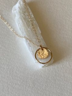 |DESCRIPTION|Delicate Circle Necklace, Gold Hammered Disc, Halo Necklace, Minimalist Jewelry, Bridesmaid Gift Idea, Everyday Necklace, Birthday GiftSweet and dainty small circle with hammered disc, perfect for everyday wear or a great gift idea.. Made of 14k gold fill. Circle measures 16mm and hand hammered disc measures 10mm. Your choice of length of chain|CURRENT PRODUCTION SCHEDULE|All items are made to order so please check the top of our policies page for the up to date production and deliv Simple Hammered Rose Gold Jewelry, Dainty Circle Charm Necklace With Adjustable Chain, Everyday Minimalist Hammered Charm Necklaces, Dainty Hammered Charm Necklaces For Everyday, Dainty Circle Adjustable Necklace, Dainty Hammered Round Pendant Jewelry, Minimalist Hammered Round Disc Necklace, Hammered Round Disc Minimalist Necklace, Dainty Circle Charm Necklace For Gift