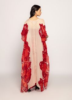 Editor's Note Create a captivating ensemble with a bandhani placement print maxi batwing cape, an intricate mirrors and thread embroidered bustier with adjustable straps, and a draped asymmetri...