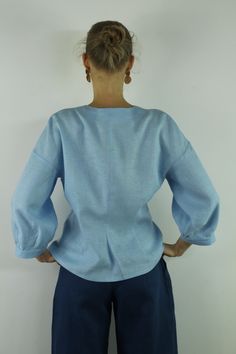 "Write the selected color in the message Handmade sky blue V neck linen blouse with front buttons and long sleeves, perfect for casual wear and suitable for any occasion in any season Details: - 100% natural linen produced in Europe ; - medium weight (180 gram per square meter); - color: sky blue, could be any from our colors catalog (color samples at the photo); Made to order, approximately a few days, If you have any questions please message me and I will be glad to answer. Size guide : Size X Light Wash Linen Button-up Top, Light Blue Summer Tops With Button Cuffs, Linen Tops With Button Cuffs For Work, Light Wash Long Sleeve Tops For Daywear, Light Blue Buttoned V-neck Blouse, Light Blue Long Sleeve Blouse For Daywear, Light Blue Long Sleeve Blouse With Buttons, Light Blue Long Sleeve Tops For Daywear, Light Blue V-neck Blouse For Daywear