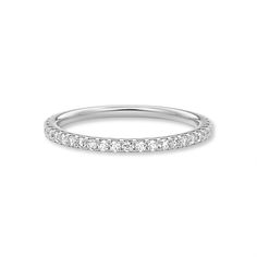 a white gold wedding band with five diamonds on the top and bottom, set in 18k