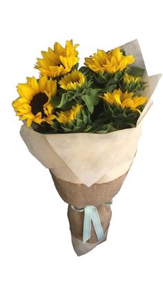 a bouquet of sunflowers wrapped in brown paper