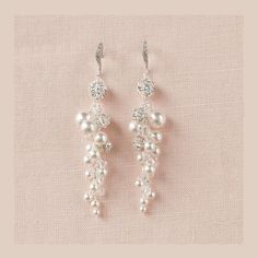 "Brilliant and full of sparkle!    These earrings are created with swarovski pearls, Swarovski crystals and crystal rhinestone balls for a truly luxurious look.   Gold earrings are made with Swarovski cream pearls and Swarovski crystal golden shadow crystal beads. Measurement of dangle portion of earring is 2 1/4\"  (3\" including ear wire) Matching bracelets: https://www.etsy.com/listing/70655952/pearl-bridal-bracelet-rhinestone-wedding https://www.etsy.com/listing/68987540/pearl-wedding-bracel Bridal Cuff Bracelet, Gold Wedding Earrings, Pearl Bridal Earrings, Pearl Bracelet Wedding, Long Pearl Earrings, Gold Earrings Wedding, Crystal Bridal Earrings, Drop Earrings Gold, Pearl Earrings Wedding