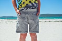 Waves & Wild (W&W) is the new name for Made by Jacks Mum (MBJM). W&W patterns can now be bought direct through our own website: www.wavesandwild.com   The Shoreline Shorts pattern is a simple but simply perfect kid shorts pattern. There are two lengths to choose from,  optional pockets and an elasticated waist. The pattern is designed for medium weight knit fabrics such as French Terry or sweatshirt fleece. The Shoreline Shorts pattern goes from Prem./Small Newborn - Age 12. It is suitable for enthusiastic beginners. An overlocker/serger can be used for many steps but importantly a regular sewing machine is all you need for all options. This listing is for 4 downloadable PDF files: Instructions, a print-at-home pattern, a copy shop pattern and a projector pattern. Print the print-at-home p Shorts Sewing Pattern, Shorts Sewing, Knitted Teddy Bear, Wild Baby, Shorts Pattern, Knit Fabrics, Hang Ten, Sewing Patterns For Kids, Short Coat Jackets