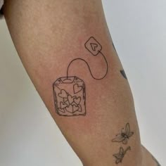 a person with a tattoo on their arm has a piece of cake in the shape of a puzzle