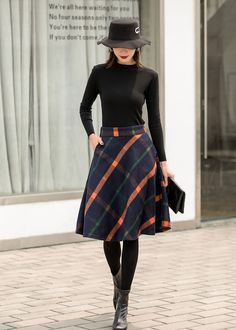 "This winter wool skirt is a classic piece of tailoring that will see you through rain or shine. It is cut with a flattering flared skirt to give you a wonderful shape. The winter skirt is perfect classic styling. This is a versatile skirt that you'll wear again and again. DETAILS: * 30% wool, 30% fiber, 40% polyester * fully satiny liner * Two side pockets * Right zip closure * A letter Back elastic, comfortable wear * Plus size full skirt * Perfect for Winter, autumn * Learn More about the ite Fall Relaxed Fit Lined Pencil Skirt, Fall Relaxed Lined Pencil Skirt, Winter Pleated Mini Skirt, Fall Lined Pencil Skirt, Winter Workwear Plaid Mini Skirt, Winter Workwear Flared Mini Skirt, Workwear Winter Flared Mini Skirt, Plaid Mini Skirt For Winter Workwear, Winter Lined Midi Pencil Skirt