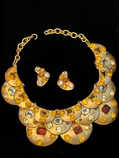 "Unsigned Italian necklace and earrings by Baroness Luciana Aloisi de Reutern, who designed for Gucci and Elizabeth Arden and also exported directly to the United States. Circa 1965. Also known as Luciana di Roma. Author Denna Farneti Cera states on p. 221 in her book Amazing Gems: \"Luciana's unusual genius enlivened the costume jewelry world beginning in the war years and then led to her even greater reputation in the coming years. In her book European Designer Jewelry - Ginger Moro says \"Luc Designer Multi-stone Gold Jewelry, Elegant Gold Multi-stone Jewelry Sets, Elegant Multi-stone Gold Jewelry Sets, Gold Jewelry With Stones For Evening, Designer Gold Jeweled Jewelry, Gold Multi-stone Costume Jewelry, Evening Multi-stone Yellow Gold Jewelry, Evening Yellow Gold Multi-stone Jewelry, Yellow Gold Multi-stone Jewelry For Evening