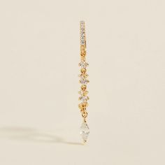 It doesn't get more glamorous than this. Jacob features dainty crystals with a marquise cut drop pendant, playfully swinging on this ornate chain earring. Not bound by any season or festivity, these earrings will dazzle on every occasion. Created for your in solid 14 karat gold, you'll want to wear these fine earrings always and never take them off, even when working out or in the shower. Teardrop Dangling Charms Jewelry For Party, Single Marquise Cubic Zirconia Earring, Chain Earring, Fine Jewelry Collection, Recycled Gold, Fine Earrings, Gold Drop Earrings, Marquise Cut, Drop Pendant