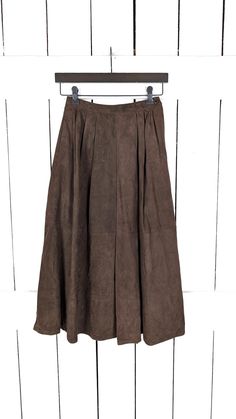 Vintage I. Magnin Kasper brown suede leather high waist midi skirt Measurements...      -marked size: 4      -waist: 23"      -length: 30" Functions: -buttery soft genuine suede leather in a rich chocolate hue -side zipper and button closure -fully lined -side pockets Condition:     -excellent vintage condition       -gently worn NY High Waist Midi Skirt, Skirt Measurements, Womens Skirts, Skirts Midi High Waisted, Brown Suede, Vintage Finds, Suede Leather, Side Zipper, Halloween Shopping