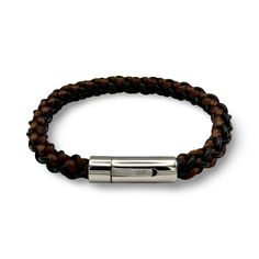 This stylish and sophisticated men's bracelet, is a must-have accessory for the modern man. Handcrafted with care and attention to detail, this bracelet features a combination of quality materials and a sleek design. The band is hand braided by leather and silk cords and it adds a touch of rugged elegance, while the stainless steel clasp ensures durability and a secure fit.  Whether you're dressing up for a special occasion or adding a touch of edge to your everyday look, this men's bracelet is the perfect choice. It's a statement piece that effortlessly elevates any outfit and makes a great gift for yourself or the fashionable gentleman in your life. Bracelet can be complimented with a matching keyring.  It comes in a velvet pouch for safe-keeping when not in use. Gift wrapping option is Black Leather Bracelet With Stainless Steel Clasp For Business, Business Leather Bracelets With Leather Strap, Business Bracelet With Leather Strap, Modern Leather Bracelet For Business, Modern Leather Braided Bracelet For Everyday, Luxury Adjustable Leather Bracelet For Business, Brown Leather Bracelet For Formal Occasions, Modern Braided Bracelets With Stainless Steel Clasp For Everyday, Modern Everyday Braided Bracelet With Stainless Steel Clasp