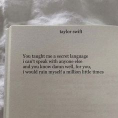 an open book sitting on top of a bed covered in white sheets and text that reads taylor swift you taught me a secret language i can't speak with anyone else