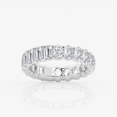 a white gold wedding ring with baguettes and round brilliant cut diamonds on each side