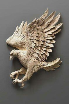 an eagle figurine on a gray background