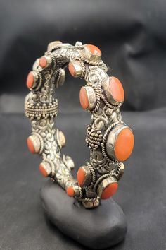 Wonderful Vintage Tibetan Silver Bangle Bracelet With Natural Coral Stone - Etsy Adjustable Orange Bracelets For Festivals, Orange Bracelet For Festivals As Gift, Bohemian Orange Bangle Bracelet, Adjustable Orange Jewelry For Festivals, Orange Bracelets As Festival Gifts, Orange Bracelets For Festivals Gift, Orange Bohemian Bangle Bracelet, Orange Festival Bracelet As Gift, Bohemian Orange Bangle Jewelry