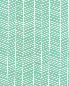 a green and white wallpaper with an arrow pattern on the bottom half of it