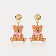 This exquisite pair of Candy Bear Earrings will add an elegant finishing touch to any look. Crafted from premium enamel, the intricate details are framed within a classic bear silhouette, creating a timeless piece of jewelry that will be appreciated for its tasteful and unique design. DETAILS Plating: 18K Gold Materials: 18K Gold on Brass, Enamel, Cubic Zirconia, Silver Size:  1.4"(36mm) Weight: 7g/pr Star And Moon Earrings, Berry Earrings, Cat Pendant Necklace, Bear Silhouette, Bear Earrings, Earrings Star, Unique Gift Wrapping, Blue Candy, Fruit Earrings